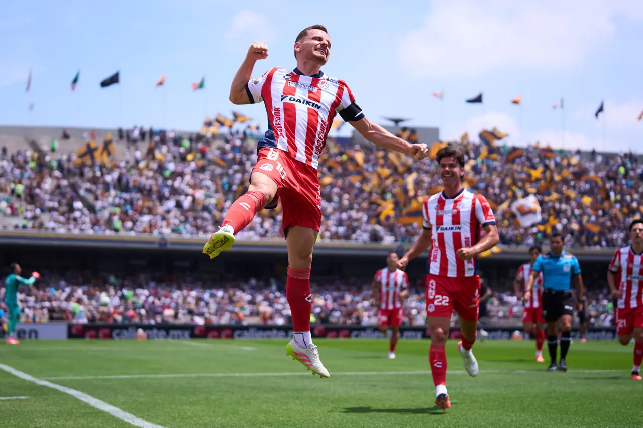 Sebastien Salles-Lamonge celebrates his goal 0-1 of San Luis during the 10th round match between Pumas UNAM