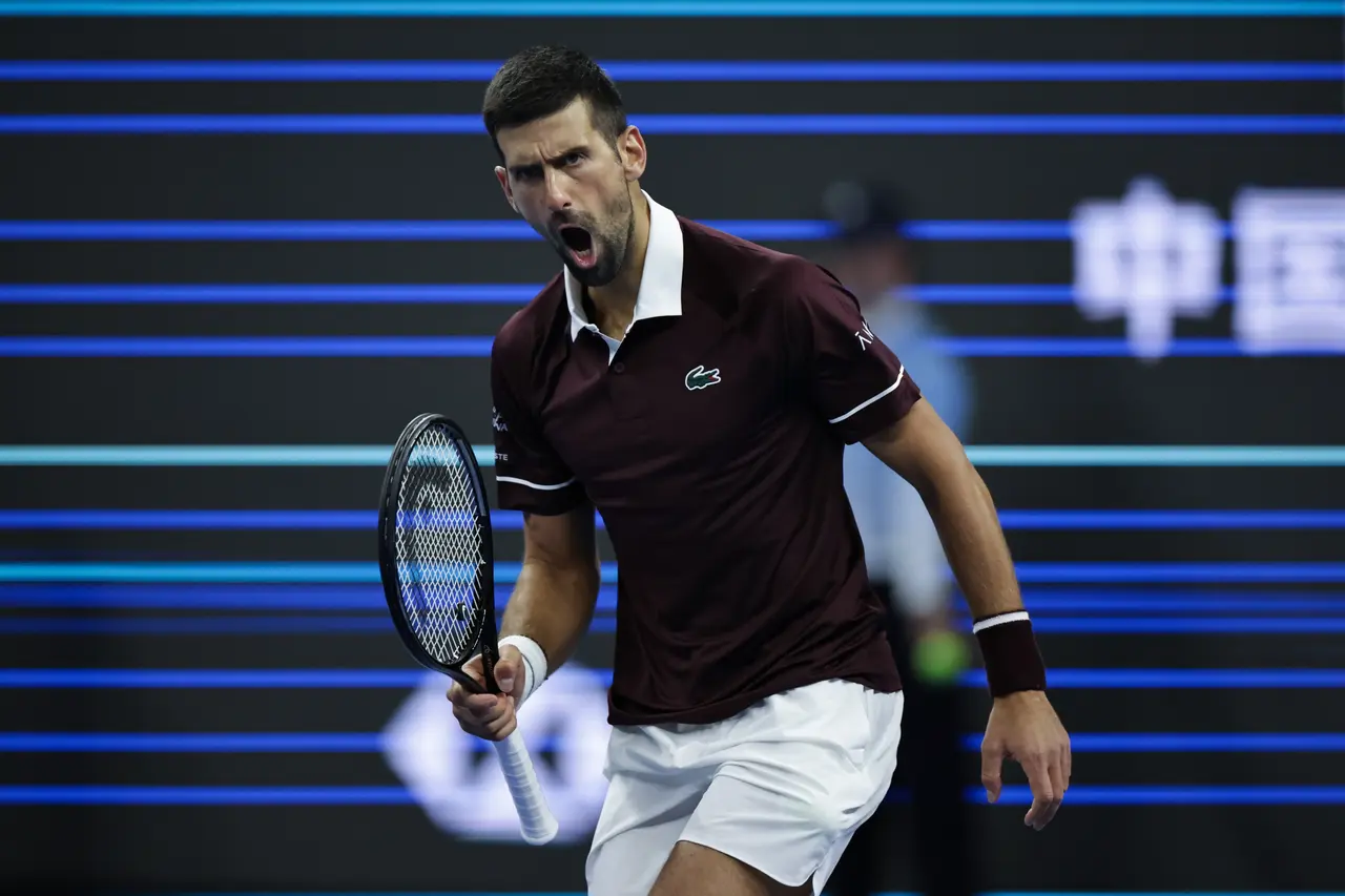 Novak Djokovic of Serbia gestures after winning his men’s singles Quarter Final match at the China Open tennis