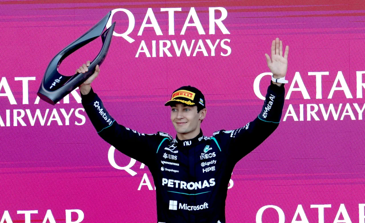 Mercedes driver George Russell of Great Britain celebrates on the podium after winning the Formula One Azerbaijan 