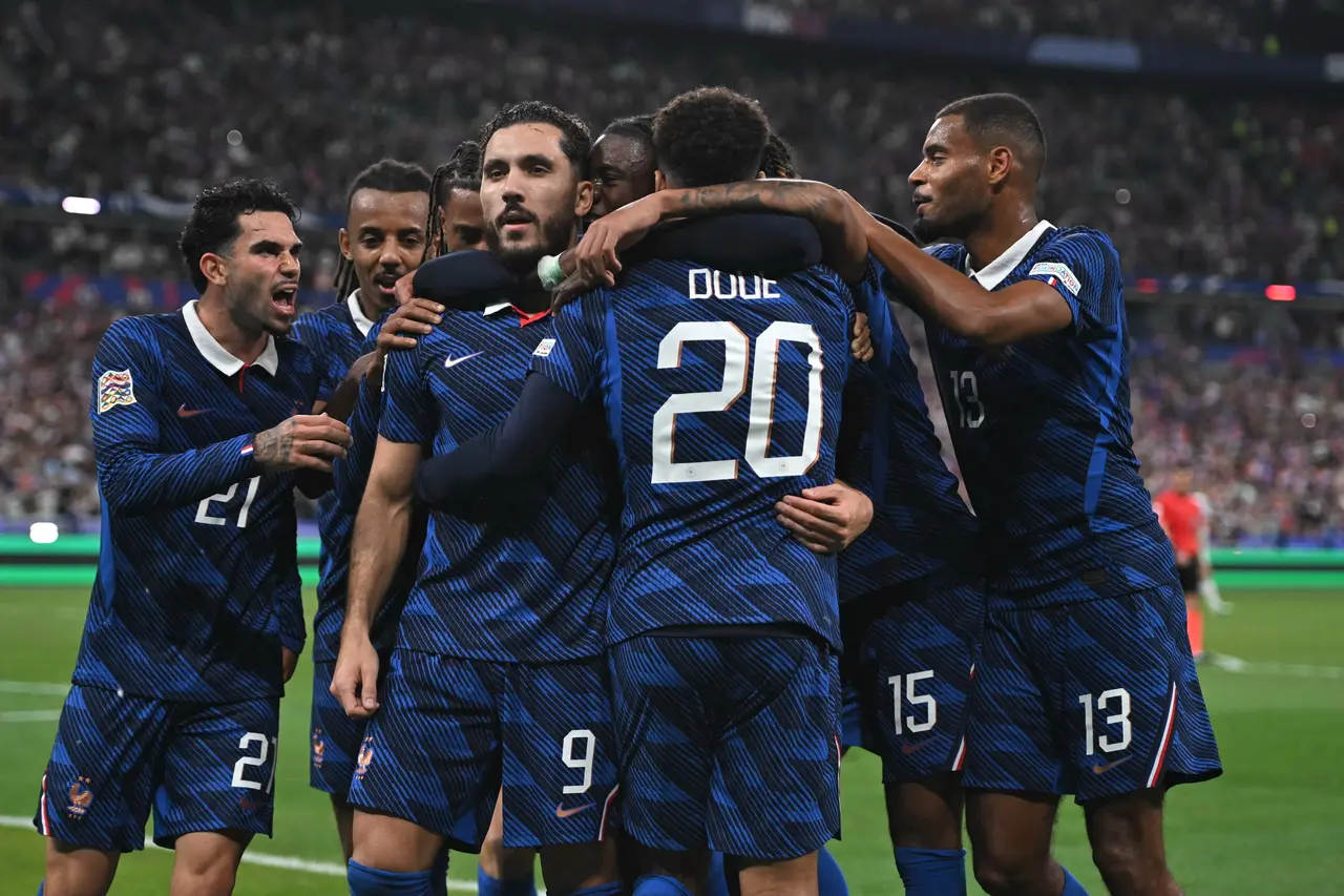  Rayan Cherki (C-L) of France celebrates with teammates after scoring the 2-1 goal during the UEFA Nations League match between France and Belgium