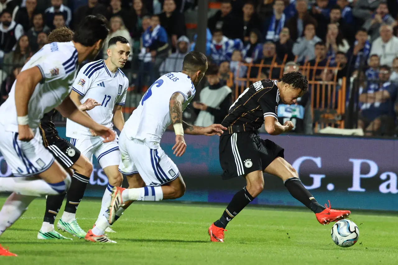 Derry Scherhant of Germany (R) in action during the UEFA Nations League soccer match between Greece and Germany